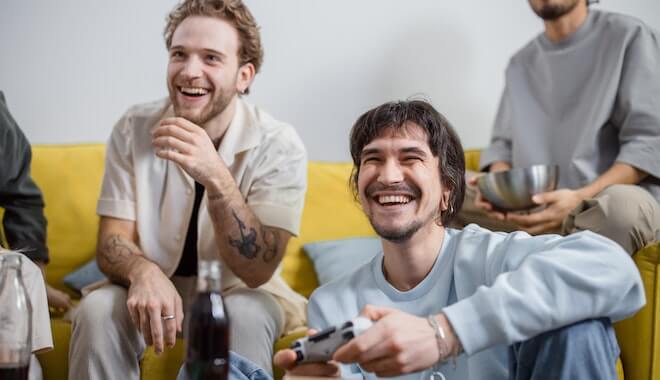 Friends hanging out and playing video games