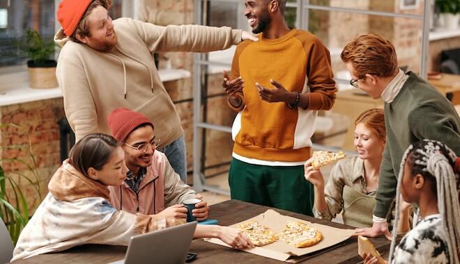 Friends connecting over pizza